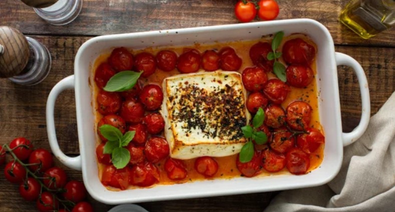 Roasted tomatoes with soft cheese and basil